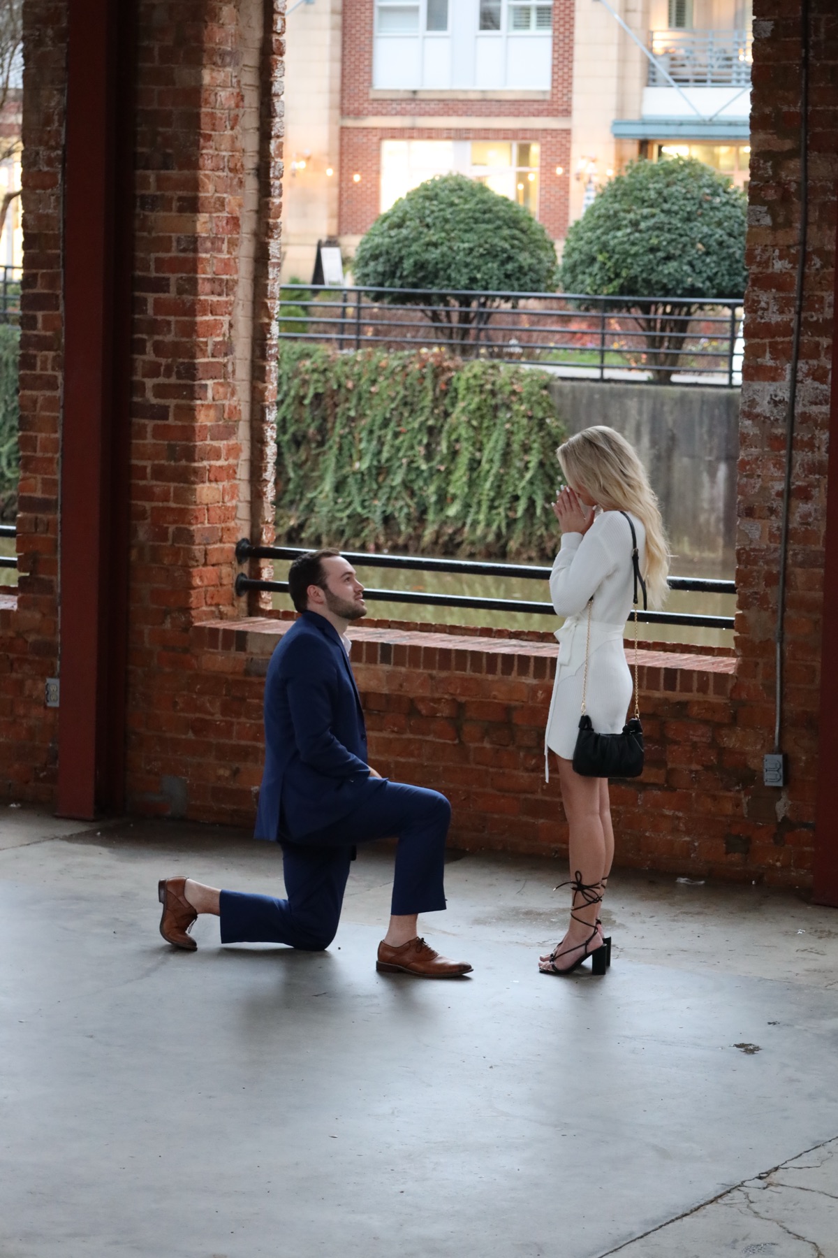 Down on one knee under the RiverPlace arches