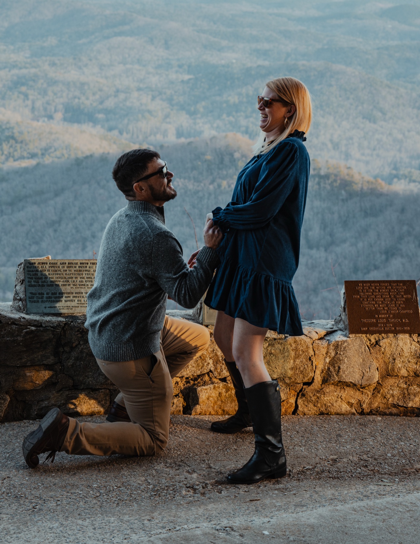 Kneeling at the Pretty Place overlook with the Blue Ridge behind them