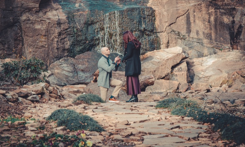 A proposal at the Rock Quarry Garden in Falls Park, in front of the waterfall